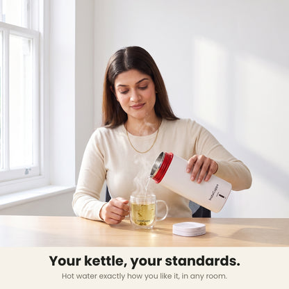 InstaCuppa Portable Electric Kettle 500 ml - White - pouring hot water into a glass mug of tea